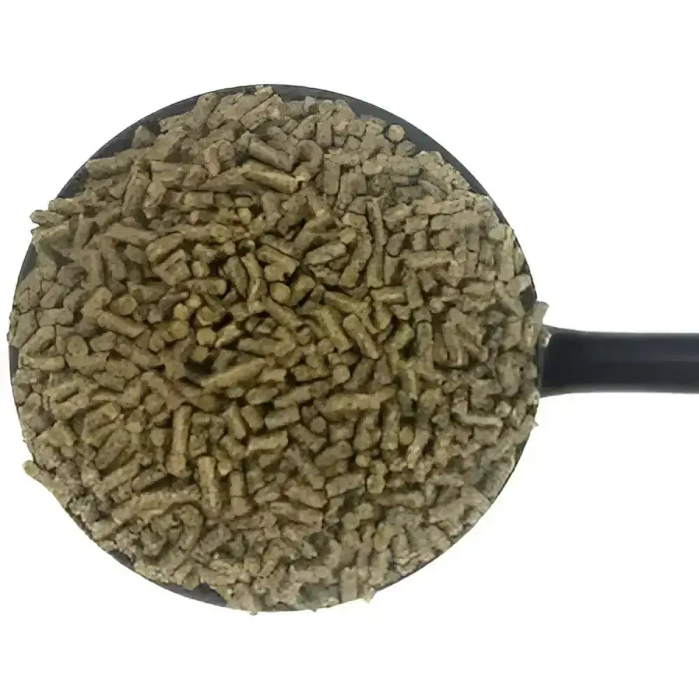 A black scoop filled with greenish brown dodson & horrell horrell ers cubes horse feed pellets