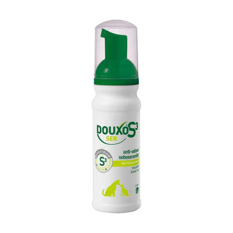 White plastic bottle with green pump of douxo s3 seb mousse designed to reduce dandruff and pet odors