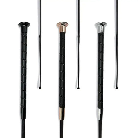 Three black dressage whip black crystal spiral riding crops with textured grips and rose gold silver and chrome caps