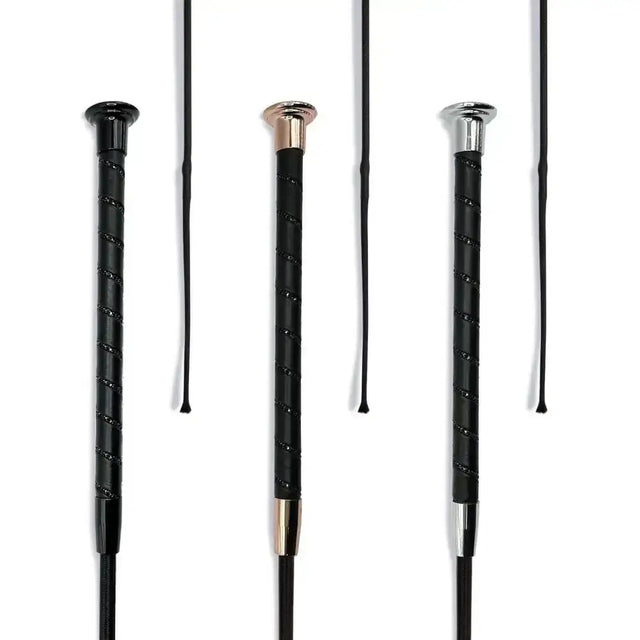 Three black dressage whip black crystal spiral riding crops with textured grips and rose gold silver and chrome caps