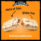 A creamy white eat natural almond and apricot yoghurt coated fruit and nut bar with visible nuts and dried fruits