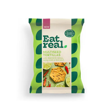 Eat real multiseed chili lime salt crisps in green and white packaging with tortilla chips lime and chili garnish