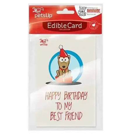 A cream edible dog birthday card with a cartoon dog in a santa hat on a snow globe and pink candles made of rawhide dog treats