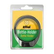 Black plastic effol bottle holder with circular design and curved base for securing bottles in horse tack accessories