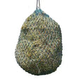 A hanging elico camborne haynet small holed haynet filled with green and brown hay and suspended by a black rope