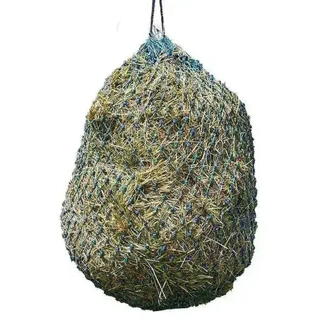 A hanging elico camborne haynet small holed haynet filled with green and brown hay and suspended by a black rope