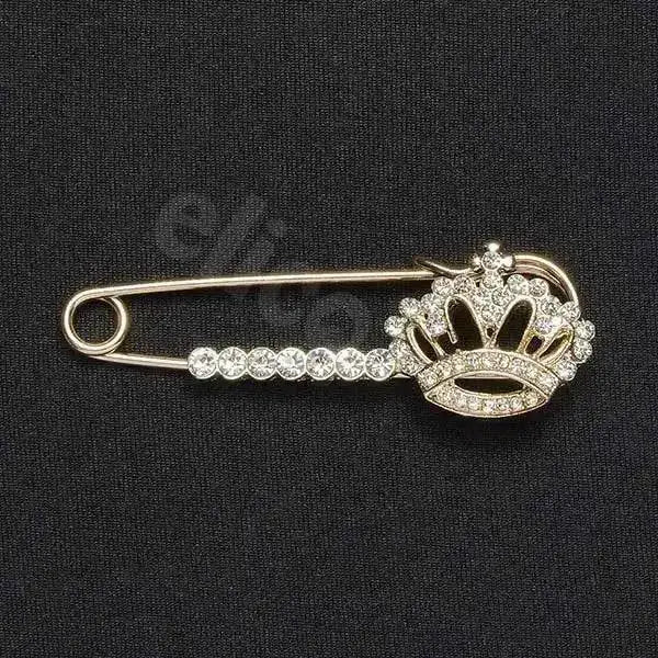 A sparkling silver elico crystal crown stock pin with jeweled crown and clear crystals along its body