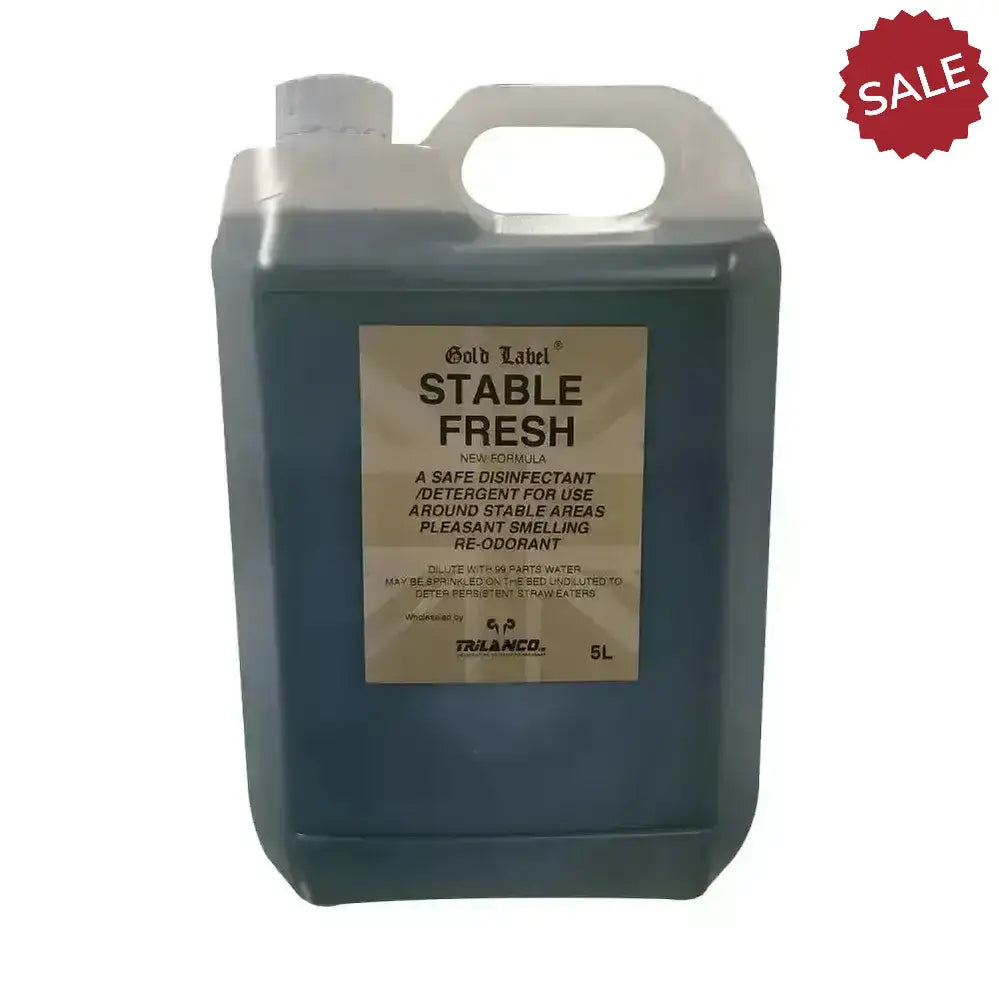A 5-liter translucent plastic jug of elico stable fresh pine disinfectant with dark blue liquid and gold label stable fresh
