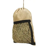 Beige elico hebden jute drawstring haybag with black trim and mesh section filled with golden straw for feeding hay