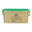 Beige plastic bucket with green lid and metal handles containing elico mint condiment pure pulverised mint for horses