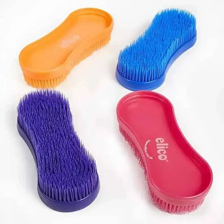 Four brightly colored elico universal grooming brushes with ergonomic plastic handles and soft bristle heads in orange blue purple and red