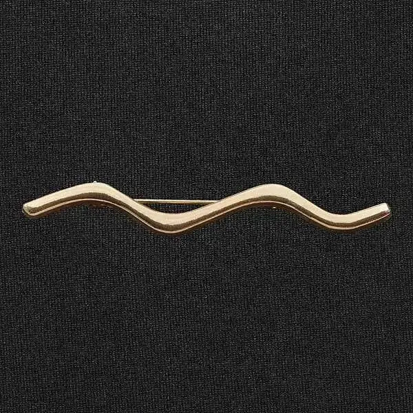 Gold-colored wavy metal elico wave stock pin with minimalist design perfect for riding apparel accessories