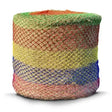 A cylindrical pouf upholstered in multicolored woven mesh with horizontal bands in the elico wild boar field haynet design
