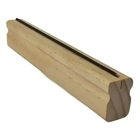 Light-colored wooden window sill with smooth grain and curved edge featured with elico wooden groomer shedding blade