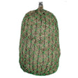 Green mesh elim-a-net slow feeding haynet filled with dry straw designed to prevent rapid forage for horses