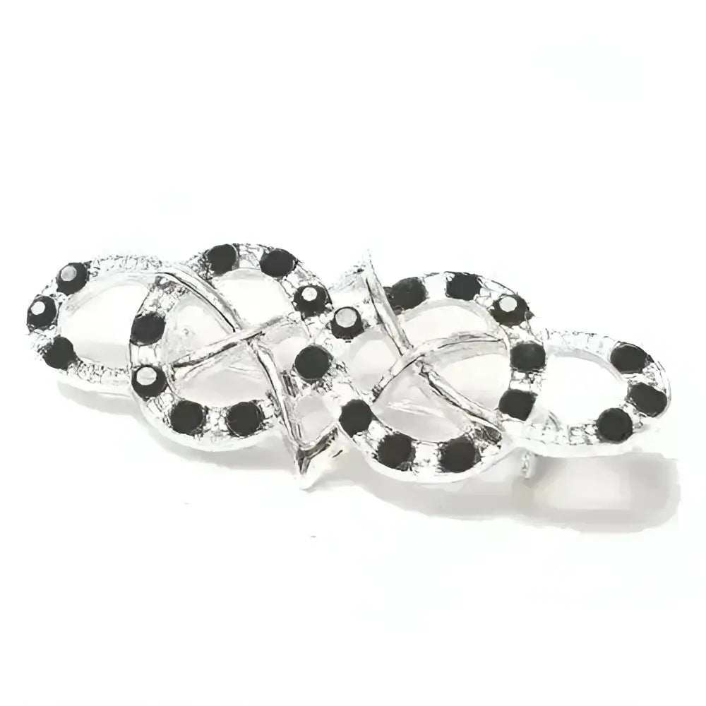 Silver equetech celtic stock pin with intricate interlocking celtic design adorned with black and clear gemstones