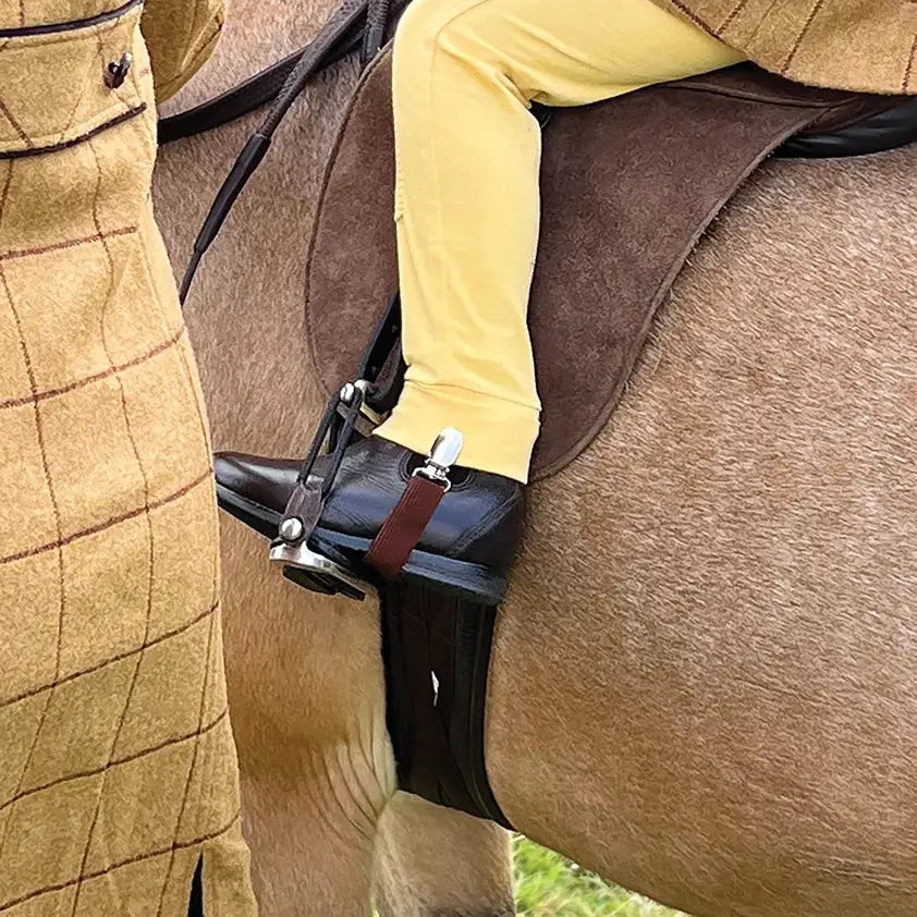 Black leather equetech childs jodhpur clips boot with silver stirrup iron and brown strap for riding use