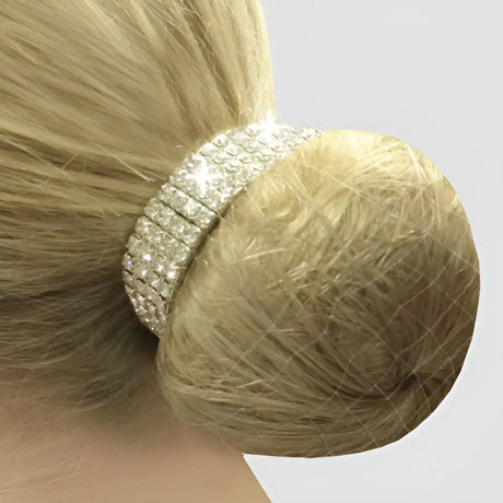 A sparkling silver equetech crystal bun ring scrunchie securing a blonde ponytail with four row crystal detail