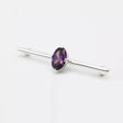A sleek silver equetech deluxe amethyst stock pin with a central oval-cut purple amethyst stone