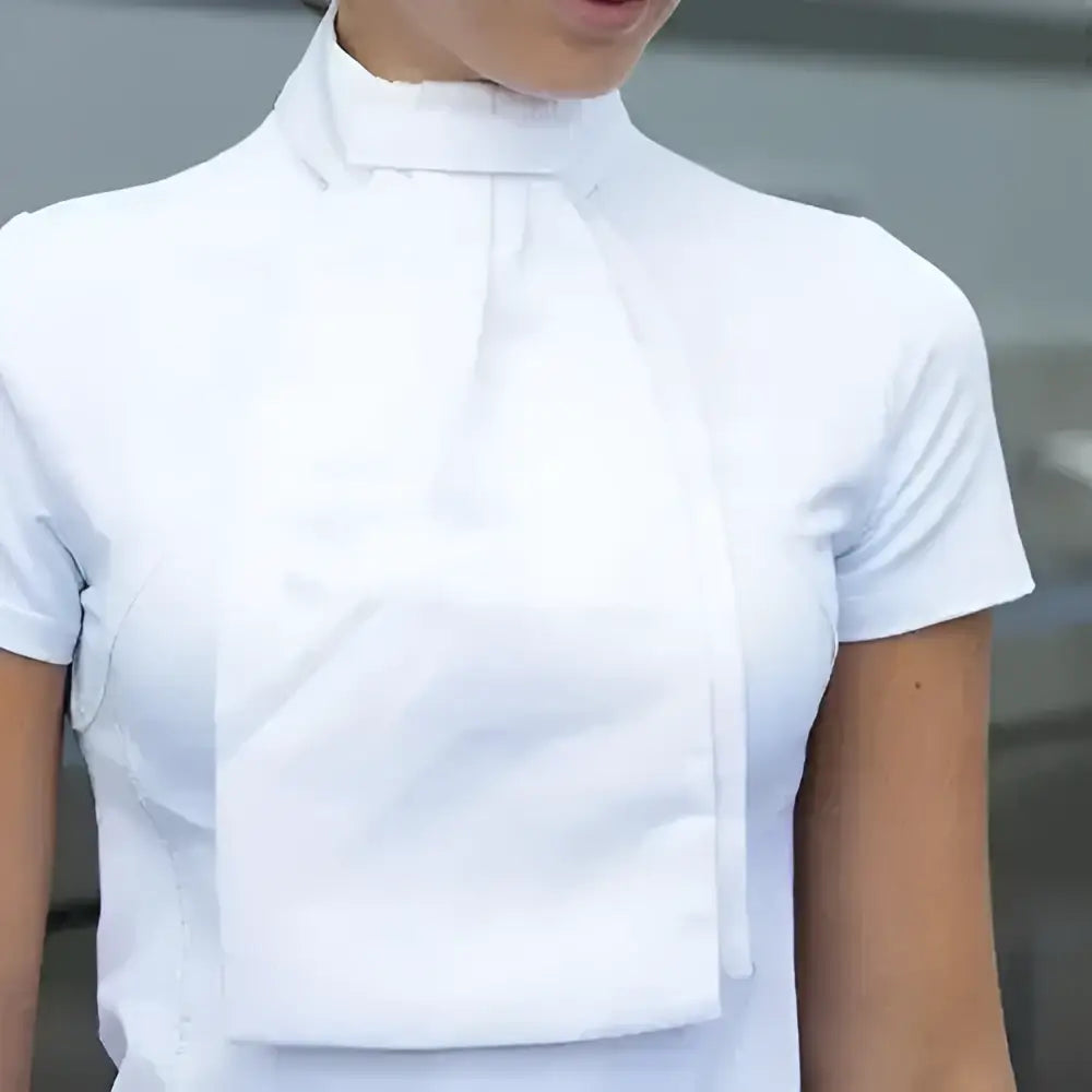A crisp white short-sleeved blouse with high collar and front pocket paired with equetech deluxe ready-tied stock three interchangeable styles