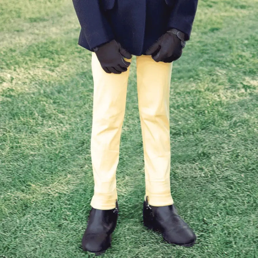 Bright yellow slim-fit equetech dinky tots jodhpurs with smooth glossy finish perfect for tots riding fun