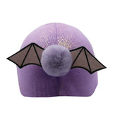 Purple glittery equetech drake dragon hat with black bat wings and matching faux fur pom-pom made of faux fur fabric