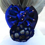 Royal blue dressage rosette ribbon bow with gold studs on a netted hair bun