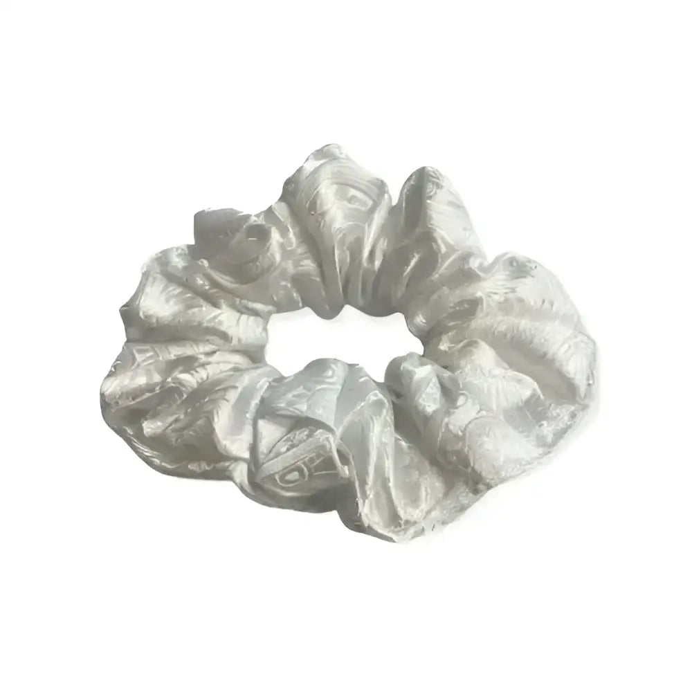 A shimmering silver satin equetech hair scrunchie with a subtle elegant paisley brocade pattern