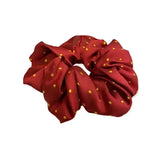 Rich burgundy equetech hair scrunchie with delicate gold polka dots jacquard hair accessory scrunchie pin spot