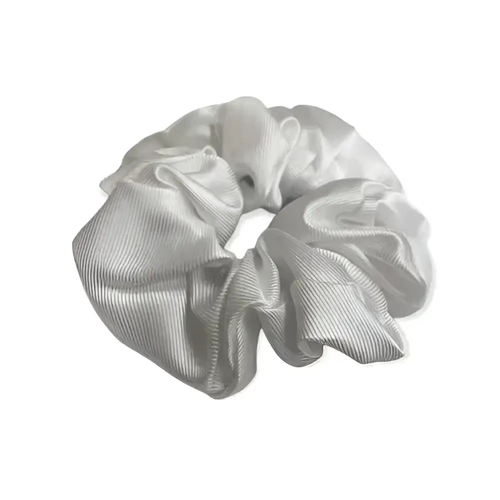 A shiny silver equetech hair scrunchie plain jacquard with a soft gathered satin texture perfect as a jacquard hair accessory