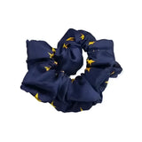 Navy blue equetech hair scrunchie with elasticated fabric and small gold star pattern perfect as a hair scrunchie stars accessory