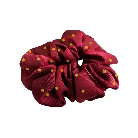A maroon equetech hair scrunchies polka dot fabric scrunchie with small gold polka dots perfect for stylish hair styling