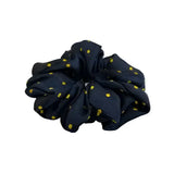 A navy blue equetech hair scrunchies polka dot fabric with small yellow dots perfect for stylish hair scrunchies polka fans