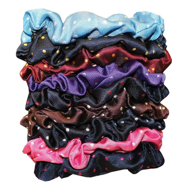 A stack of colorful equetech hair scrunchies featuring polka dot patterns and ruffled fabric in assorted hues