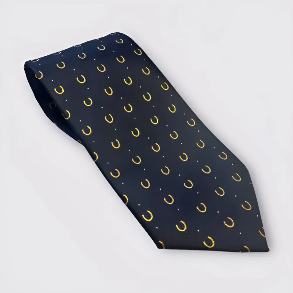 A navy blue silk equetech horseshoes show tie with gold horseshoes and white dots, one of the smartest riding ties equetech boasts