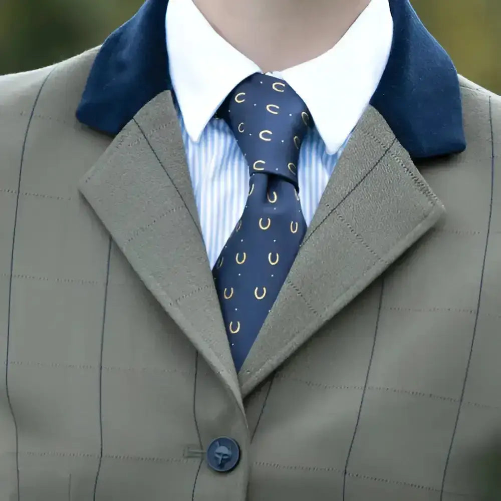 Navy blue equetech horseshoes show tie featuring gold horseshoe and c patterns from smartest riding ties collection