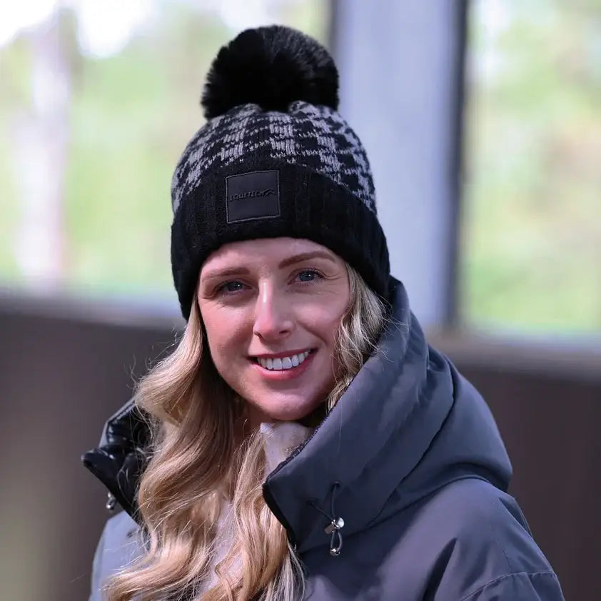 Equetech houndstooth waterproof knit hat in black and gray with a fluffy black pom pom on top