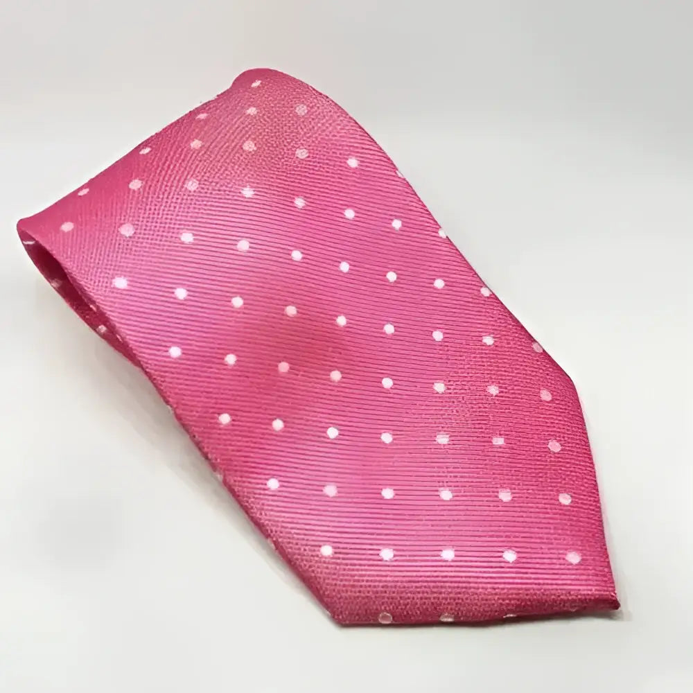 A vibrant pink silk equetech junior polka dot tie featuring a subtle white polka dot pattern ideal for junior polka dot ties