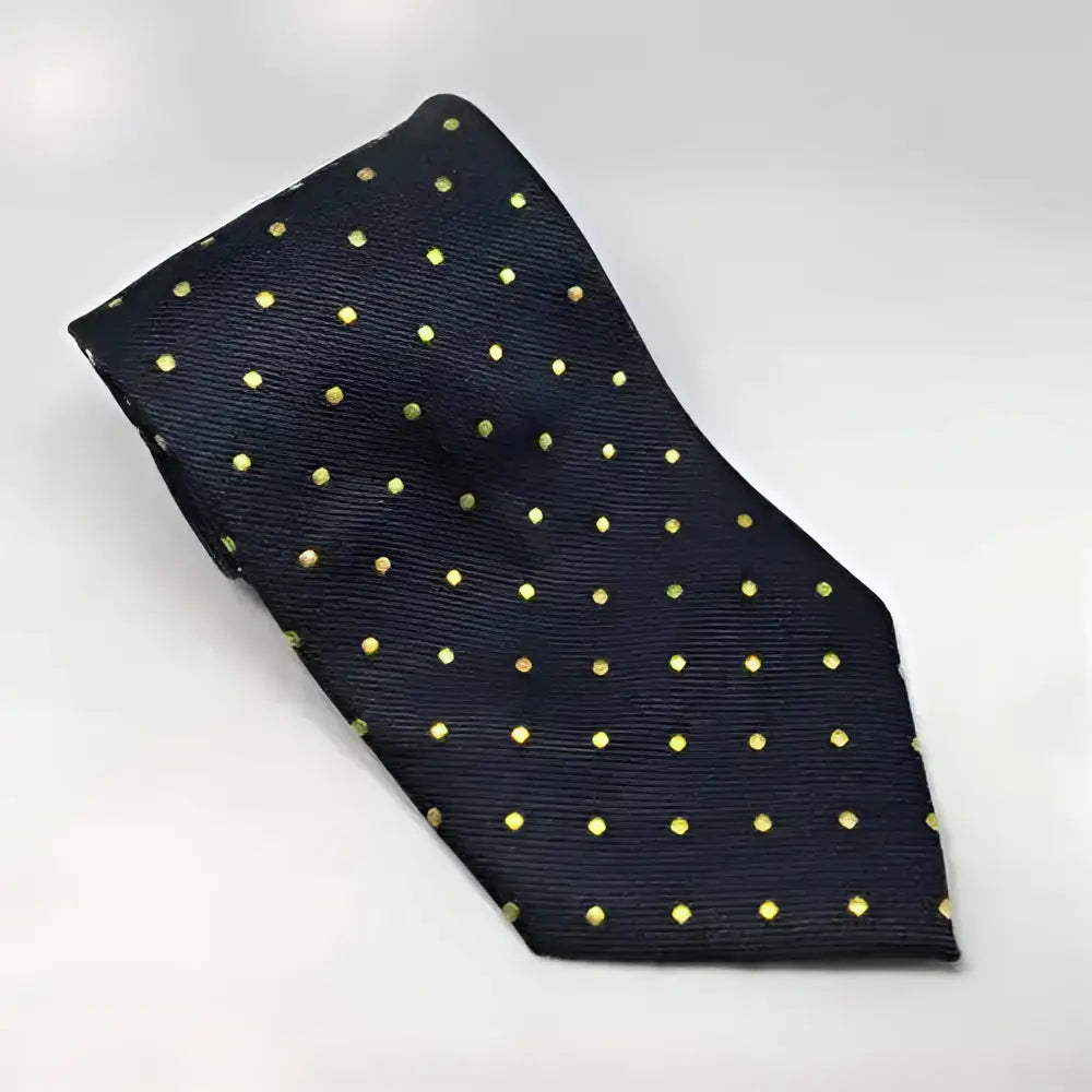 A navy blue silk equetech junior polka dot tie with small yellow dots perfect for junior polka dot ties fans