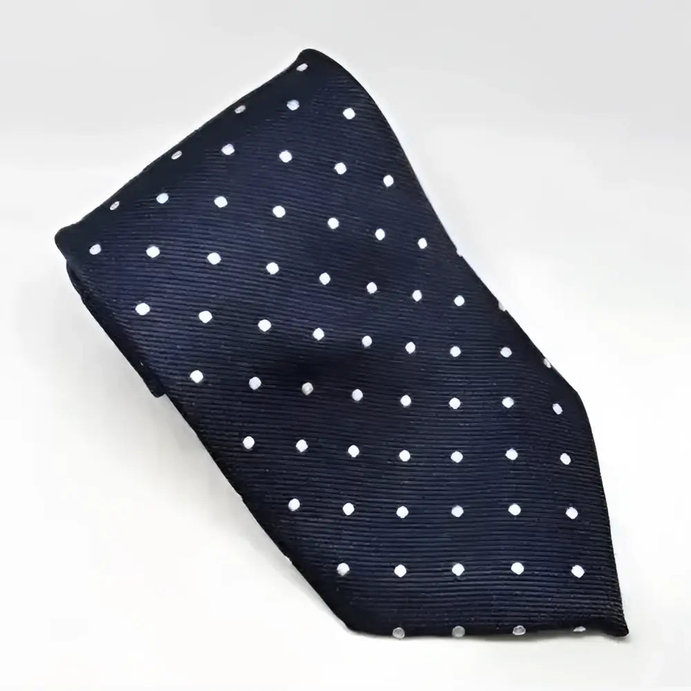 A navy blue silk tie with subtle white polka dots from the equetech junior polka dot ties collection
