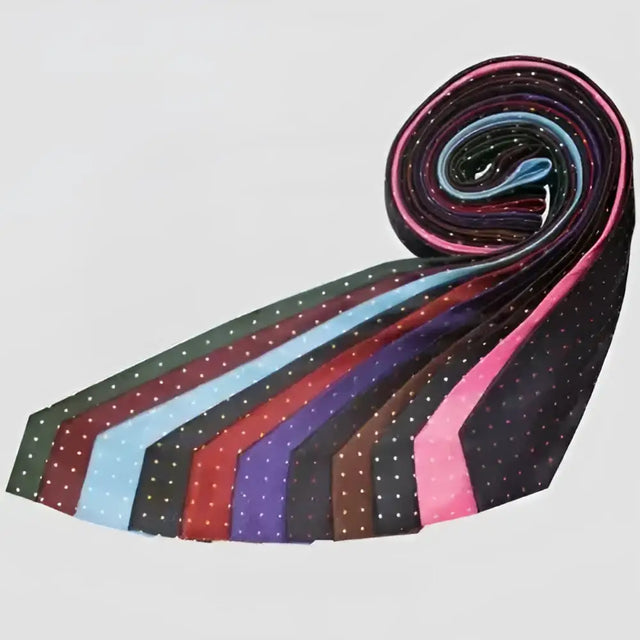 A rolled display of colorful equetech junior polka dot ties in black pink blue red and purple hues