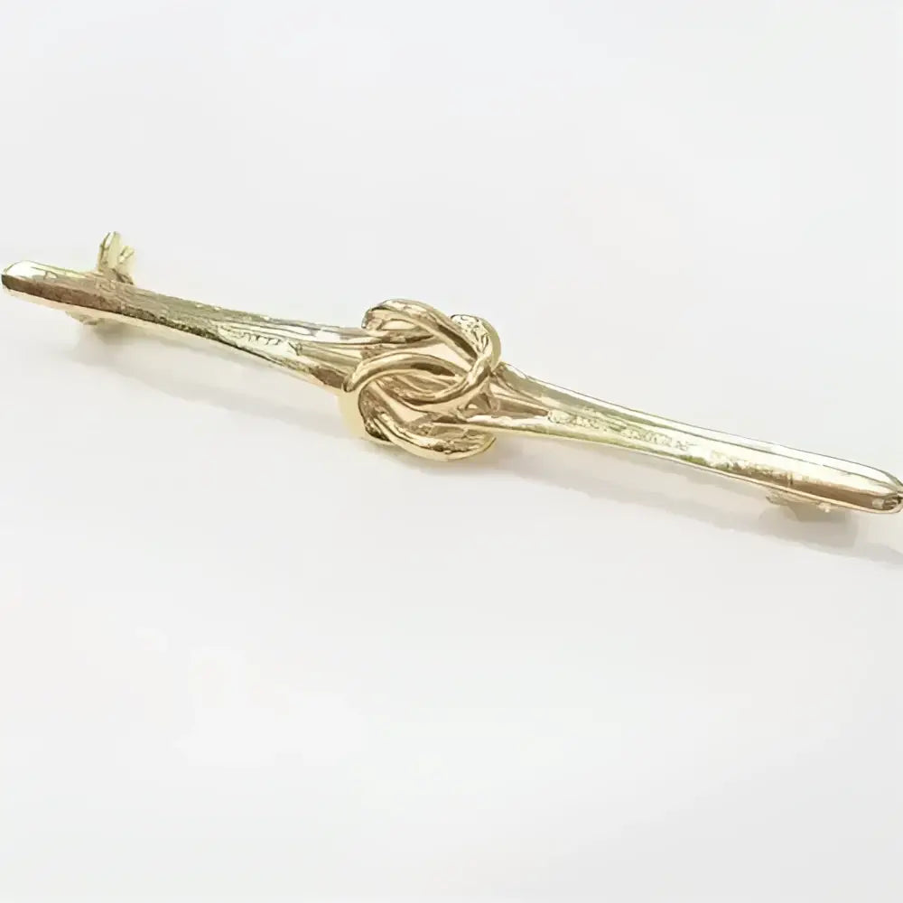 Equetech knot stock gold-colored metal tie bar with unusual double knot design pin at its center