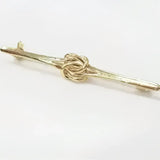 Equetech knot stock gold-colored metal tie bar with unusual double knot design pin at its center