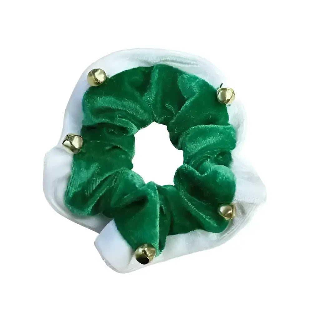 A festive green velvet christmas bells hair scrunchie with small gold bells perfect for holiday looks
