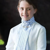 A young girl wearing an equetech pc riding stock self tying with a printed tri-check design and woven jacquard fabric