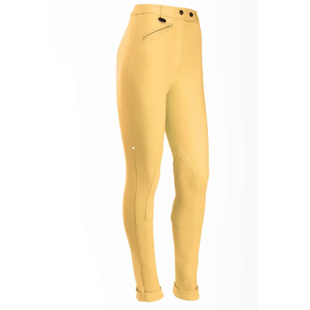 A pair of tan equetech prima competition jodhpurs with button waist closures and rolled cuffs, perfect for riding