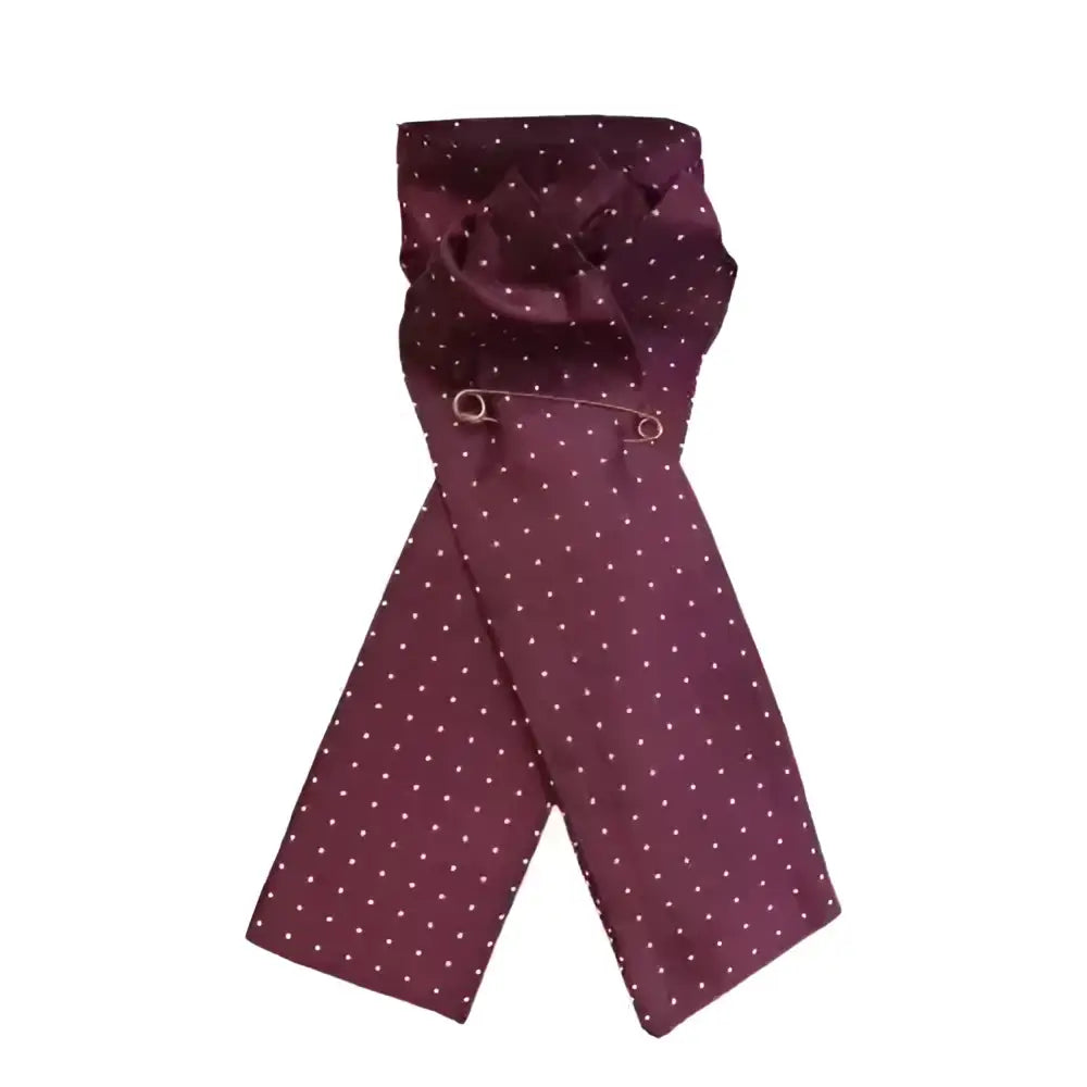 A maroon silk equetech ready-tied stocks pin spot maroon scarf with white polka dots neatly folded with a silver pin