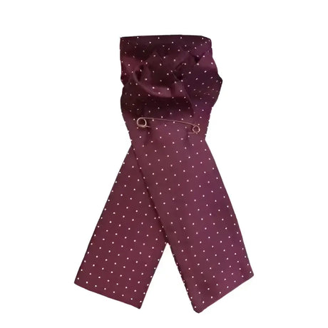 A maroon silk equetech ready-tied stocks pin spot maroon scarf with white polka dots neatly folded with a silver pin