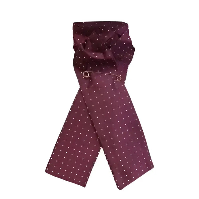A maroon silk equetech ready-tied stocks pin spot maroon scarf with white polka dots neatly folded with a silver pin