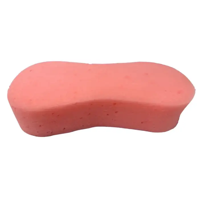 Pink oval-shaped equi-sential expanding sponge with soft porous texture for grooming horses in equestrian care